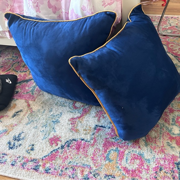2 navy with gold piping throw pillows